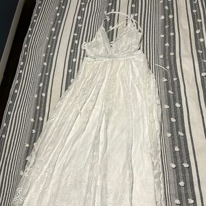 Small white long lace dress never worn before.